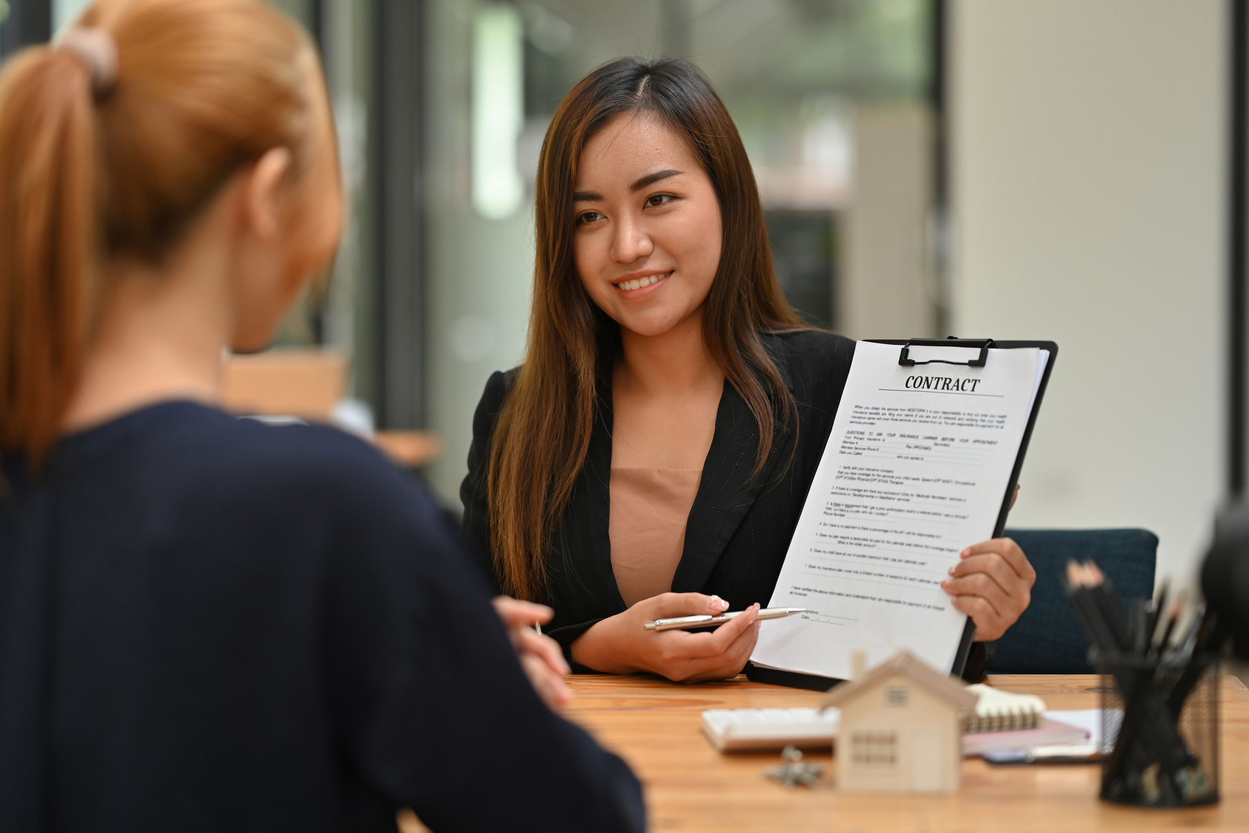 Estate agent with his customer, Negotiate with real estate agent